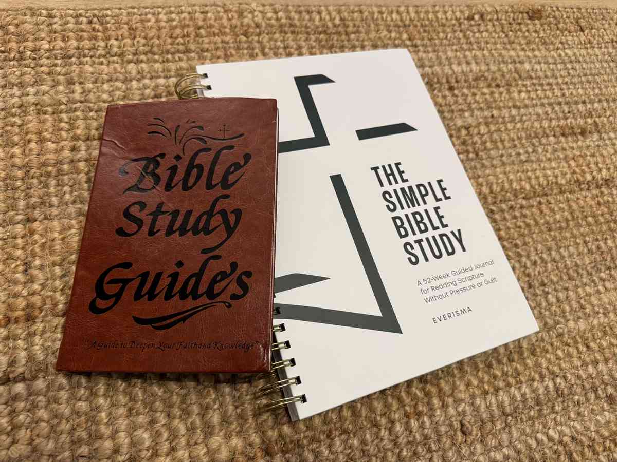 An old-style leather Bible study guide next to The Simple Bible Study by Everisma